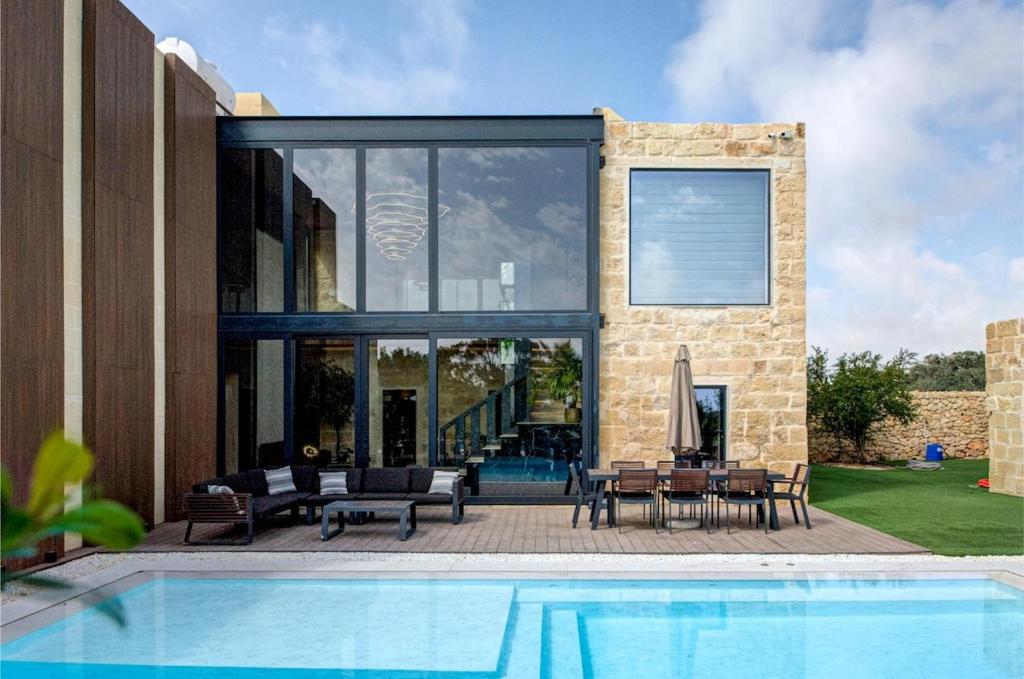The Field House, limestone and glass above the pool terrace